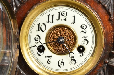 Lot 28 - A late 19th century German carved wooden mantle clock