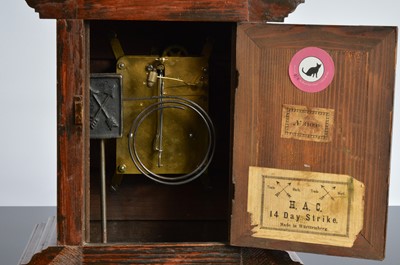 Lot 28 - A late 19th century German carved wooden mantle clock