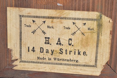 Lot 28 - A late 19th century German carved wooden mantle clock