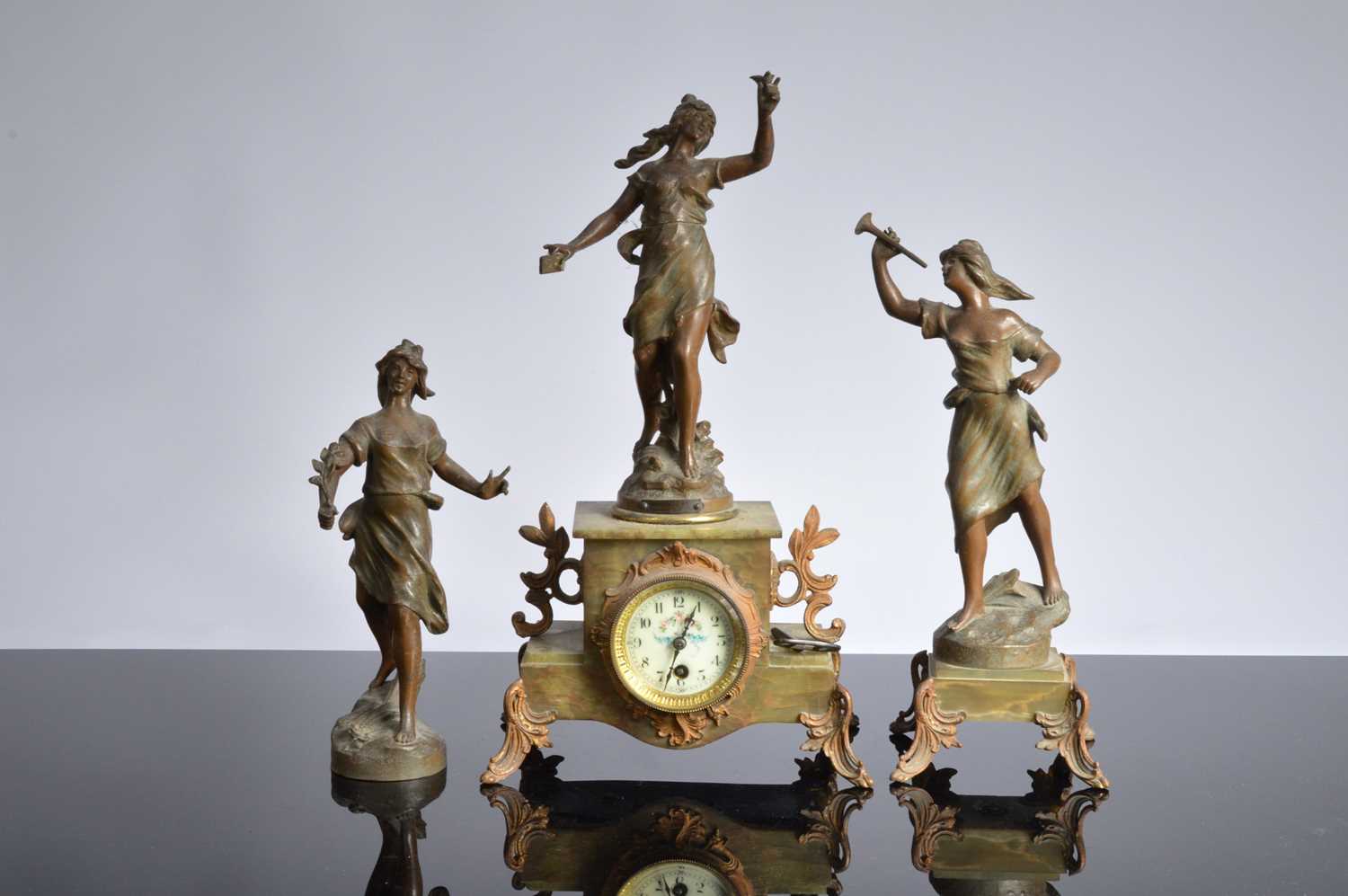 Lot 40 - A late Victorian onyx and spelter clock and garniture