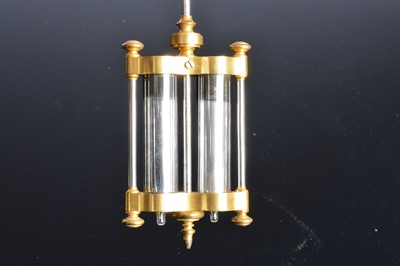 Lot 43 - A modern brass and glazed mantle clock