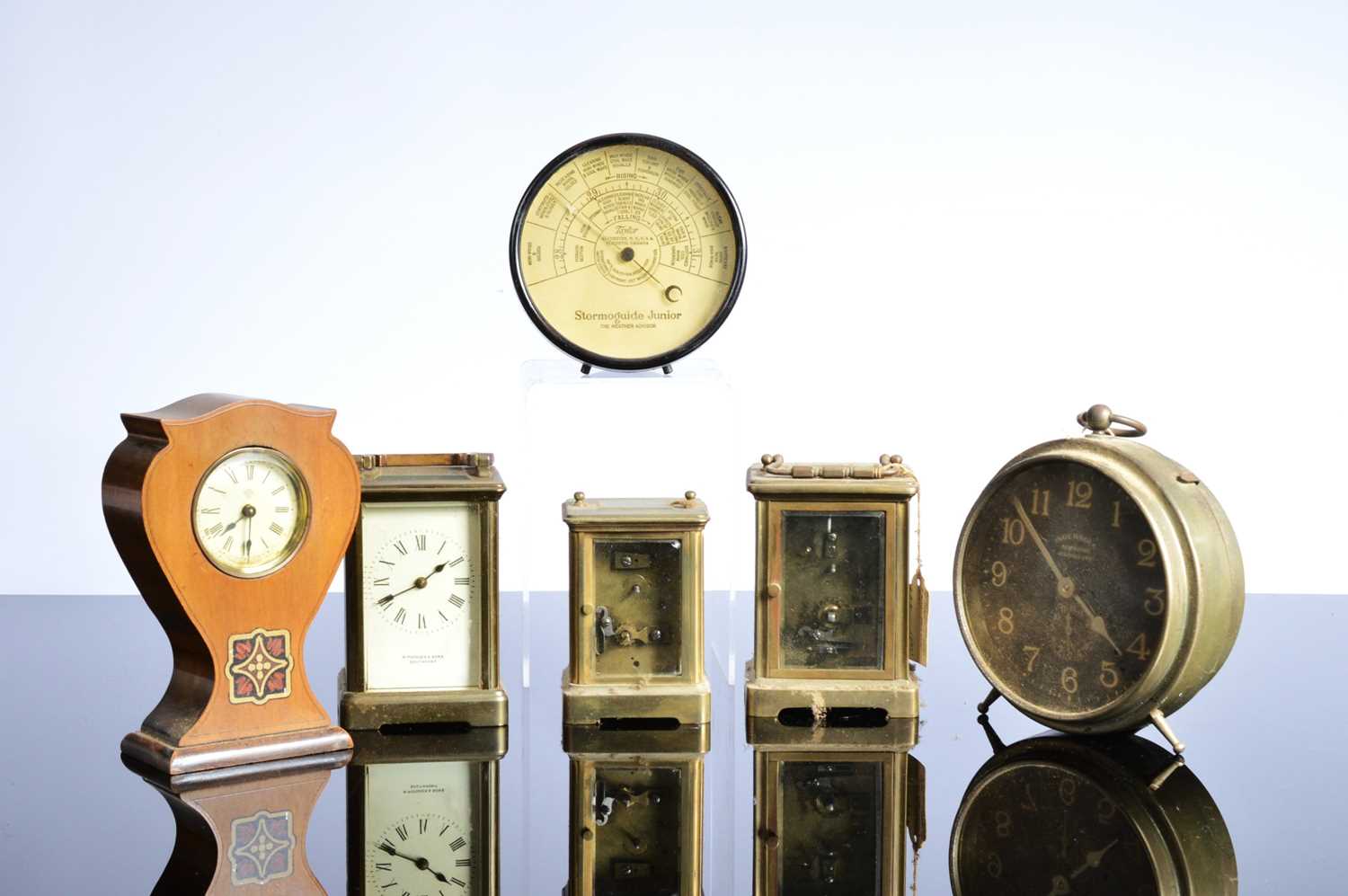 Lot 55 - Five small clocks and two barometers