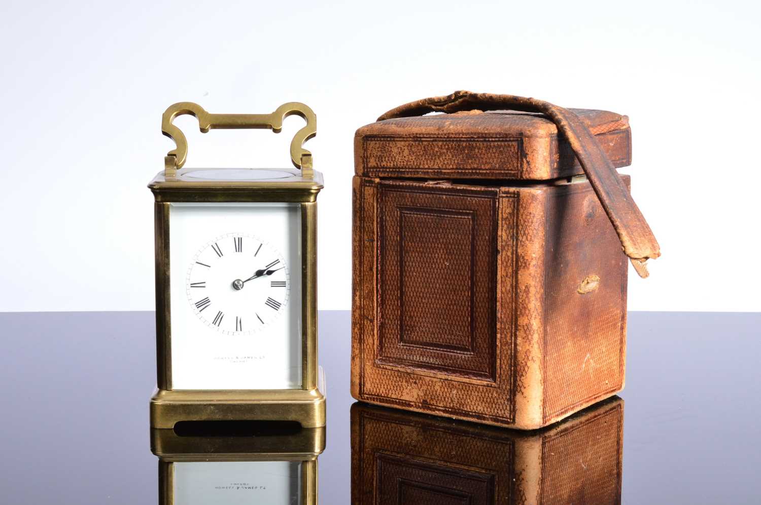 Lot 60 - A vintage brass carriage timepiece from Howell & James