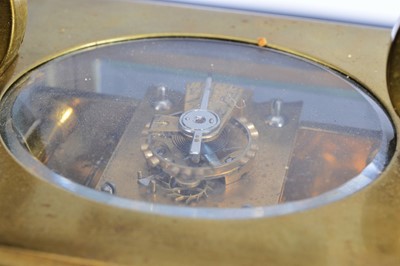 Lot 60 - A vintage brass carriage timepiece from Howell & James