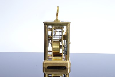 Lot 60 - A vintage brass carriage timepiece from Howell & James