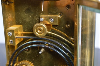 Lot 60 - A vintage brass carriage timepiece from Howell & James