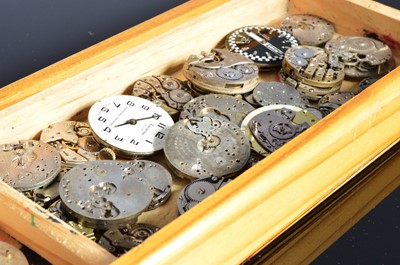 Lot 65 - A collection of watch movements and spare parts