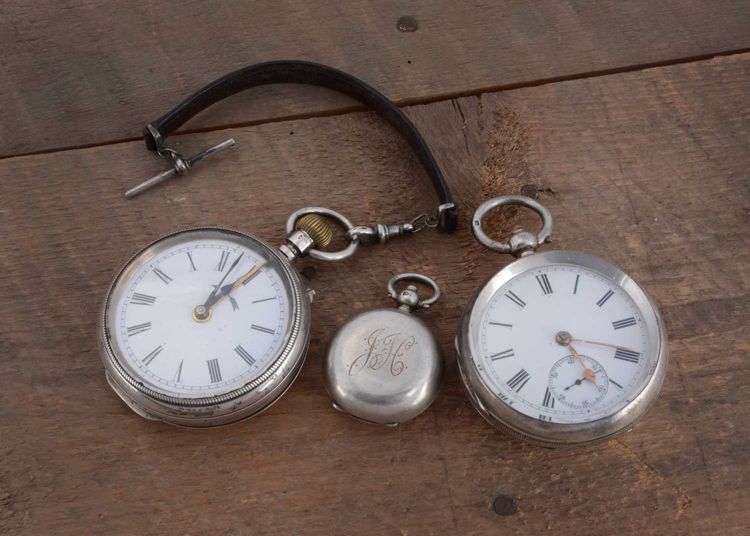 Lot 73 - Two silver open faced pocket watches and a sovereign case