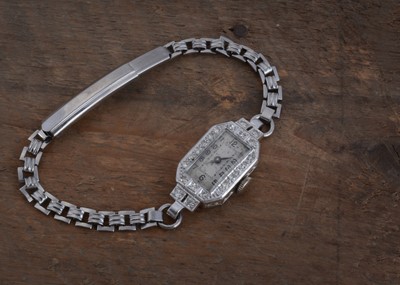 Lot 148 - An Art Deco platinum and diamond ladies cocktail dress wrist watch head