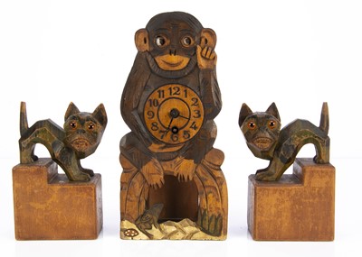 Lot 382 - An amusing carved wooden monkey clock with moving eyes