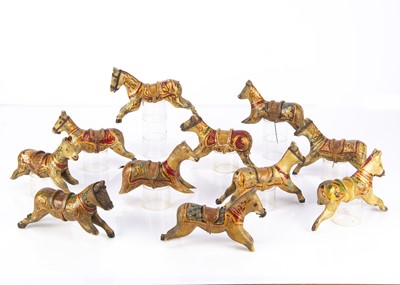 Lot 429 - Eleven carved wooden miniature carousel horses
