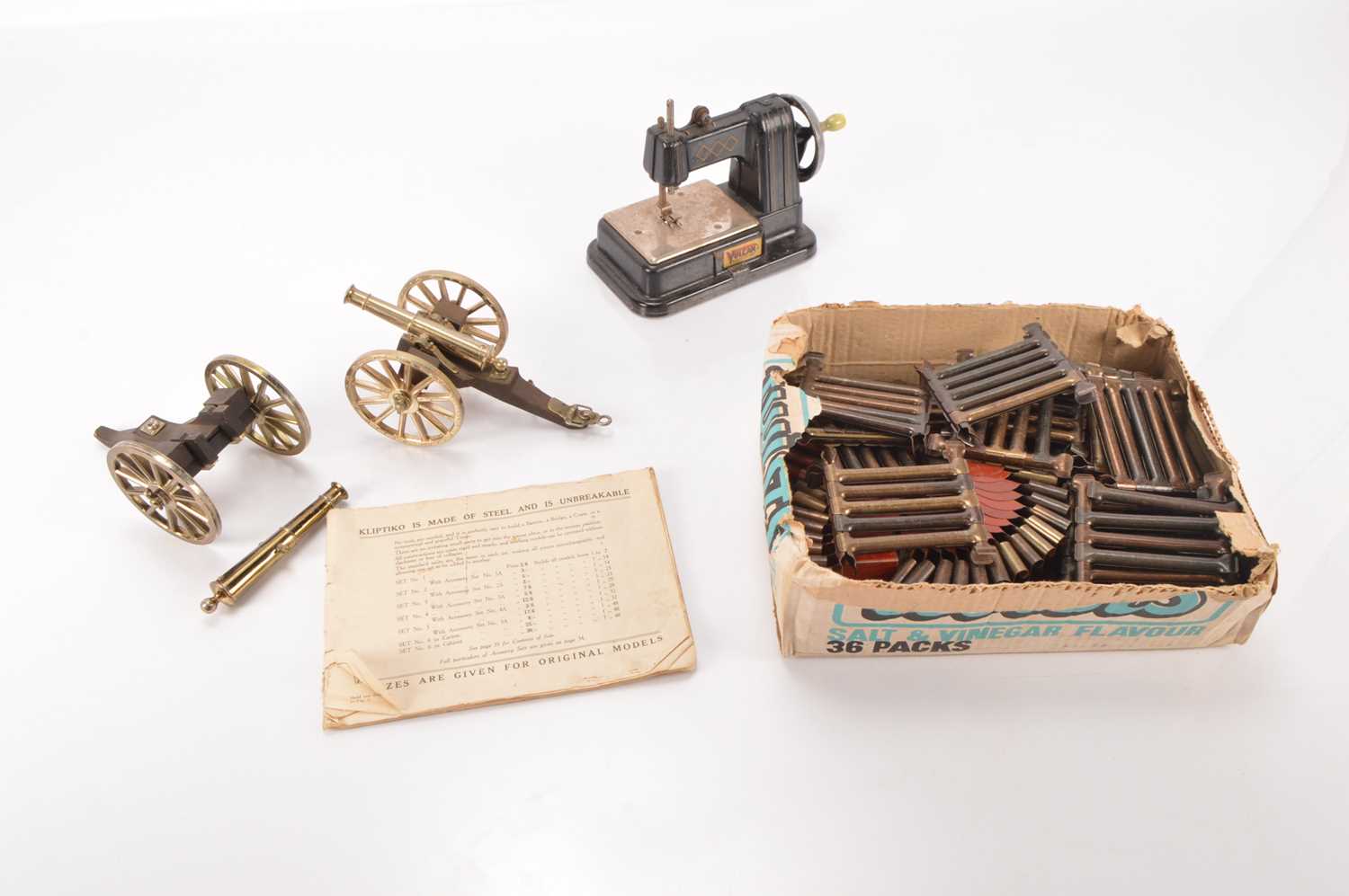Lot 580 - Uncommon Kliptiko Construction set and pair of large scale Canons and Vulcan Sewing Machine (4)
