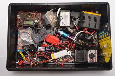 Lot 588 - Large collection of Radio Control Models and Spares including vehicles  Helicopters  RC Controls and spares including Petrol Engine Chargers Tyres Gyro Exhausts Propellers and other parts (qty in five