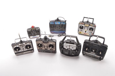 Lot 588 - Large collection of Radio Control Models and Spares including vehicles  Helicopters  RC Controls and spares including Petrol Engine Chargers Tyres Gyro Exhausts Propellers and other parts (qty in five