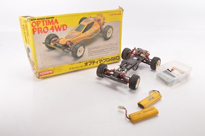 Lot 588 - Large collection of Radio Control Models and Spares including vehicles  Helicopters  RC Controls and spares including Petrol Engine Chargers Tyres Gyro Exhausts Propellers and other parts (qty in five