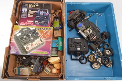 Lot 588 - Large collection of Radio Control Models and Spares including vehicles  Helicopters  RC Controls and spares including Petrol Engine Chargers Tyres Gyro Exhausts Propellers and other parts (qty in five
