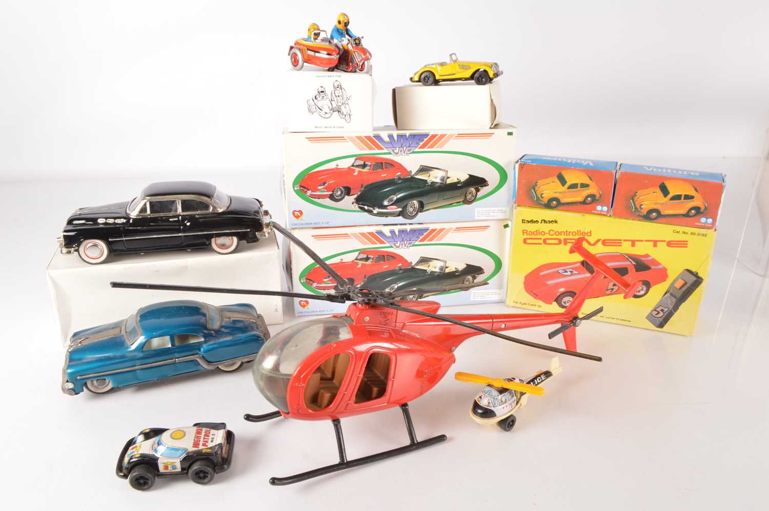 Lot 625 - Collection of boxed Chinese and Japanese and USA Tinplate Transport Toys including Cars Motorcycles and Helicopters (11)