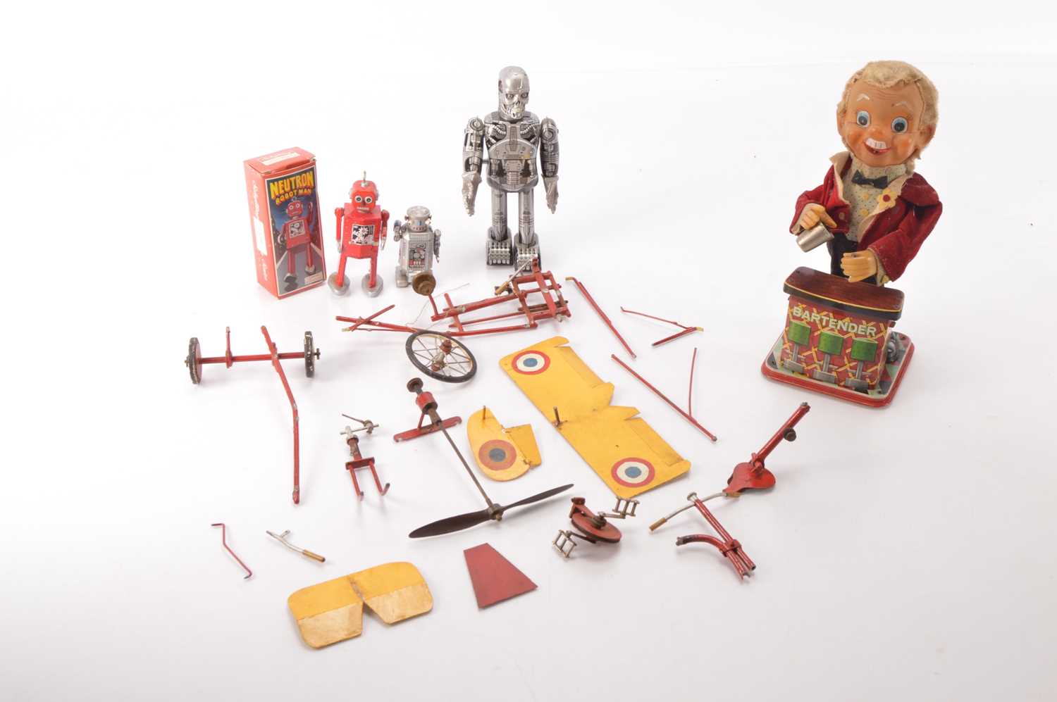 Lot 631 - TN Toys Japan Battery Operated Charlie Weaver Bartender modern clockwork Robots and a broken (in parts) novelty early style peddle powered Monoplane (5)