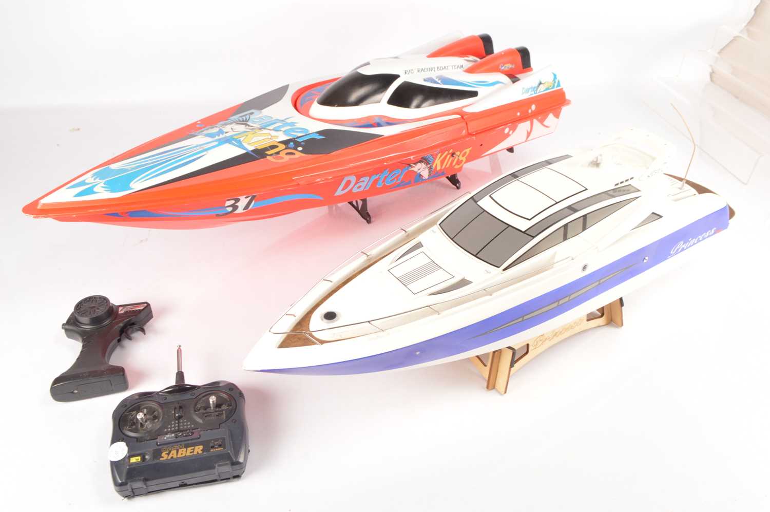 Lot 658 - Pair of large plastic Radio Controlled Boats (2)
