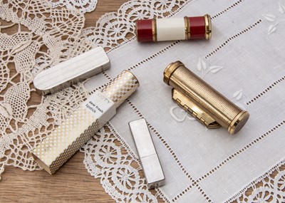 Lot 357 - Five Art Deco and later Coty lipsticks