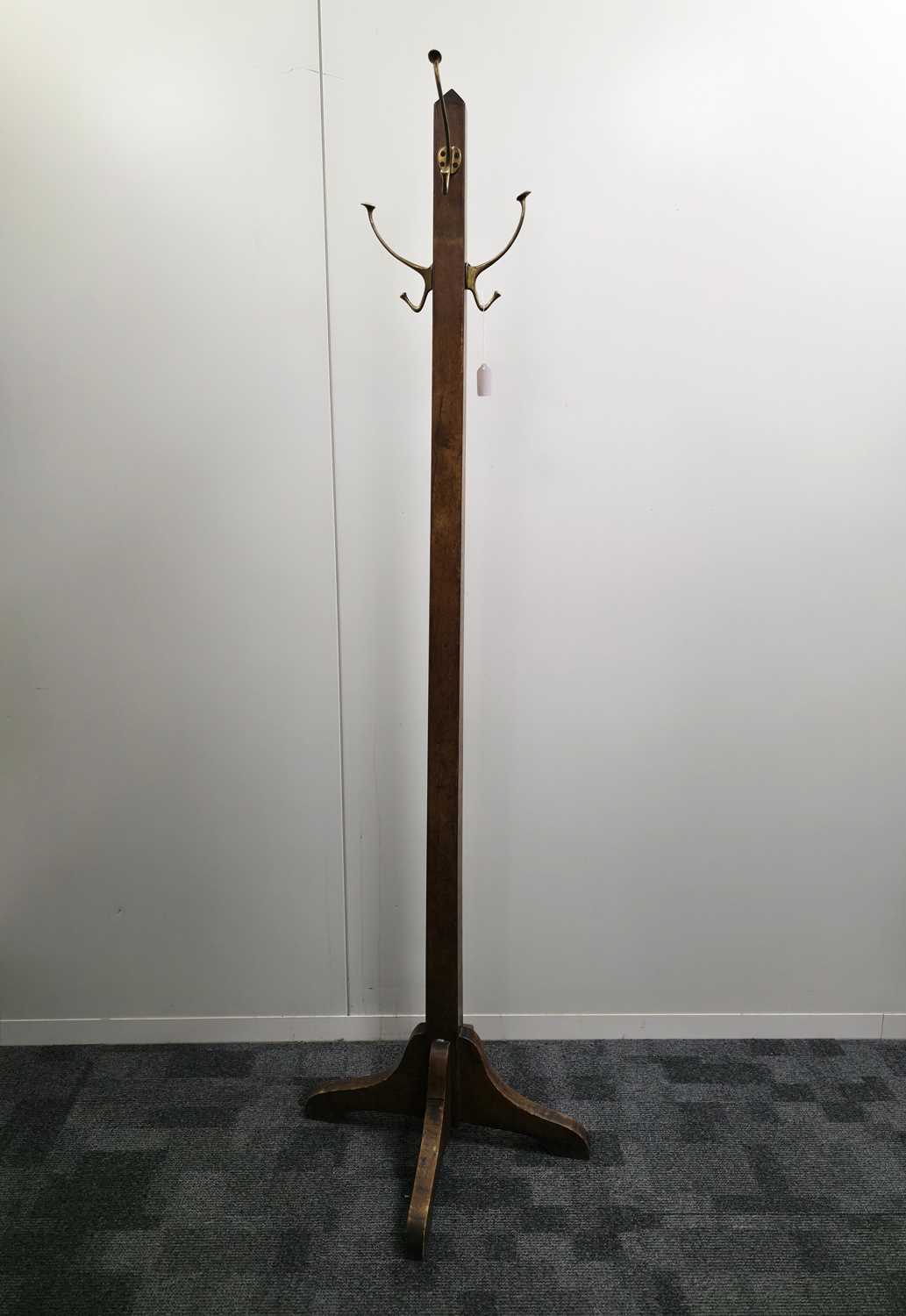 Lot 554 - An Arts & Crafts period oak coast stand