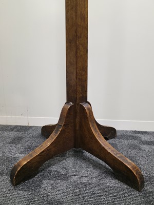 Lot 554 - An Arts & Crafts period oak coast stand