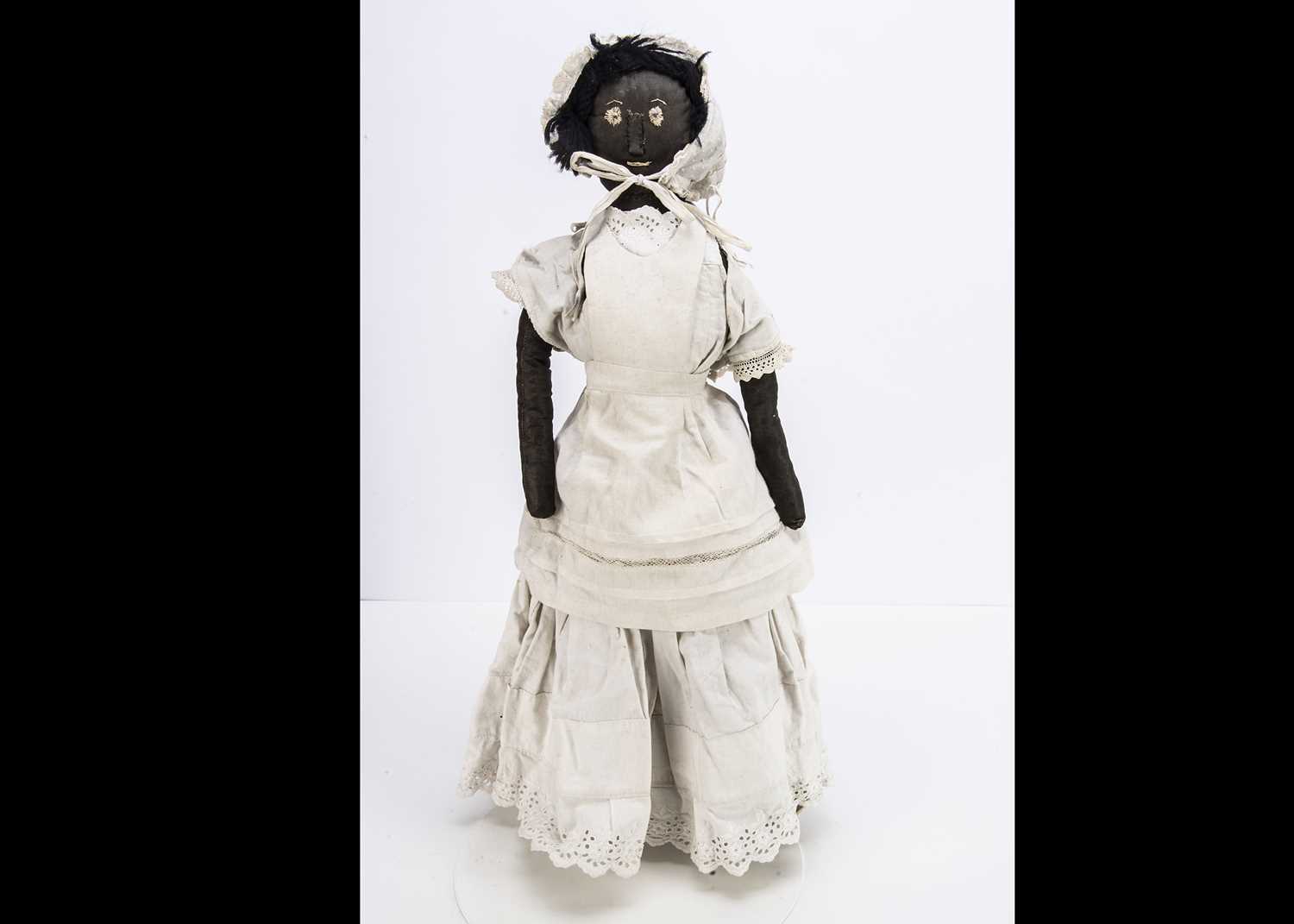 Lot 282 - A primitive black cloth doll circa 1900