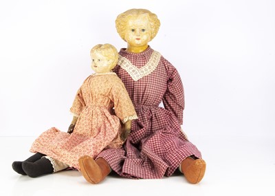 Lot 284 - A large and small Greiner type papier-mache shoulder-head dolls