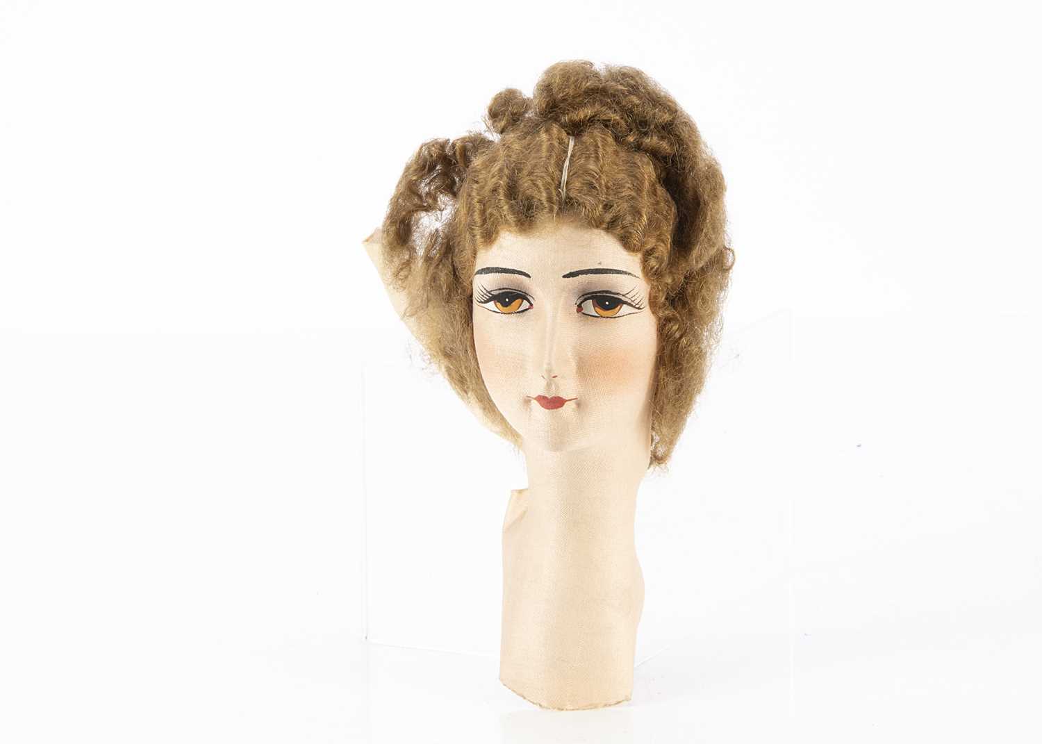 Lot 286 - A French cloth boudoir doll head