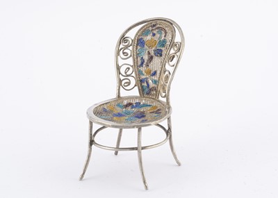 Lot 783 - A Chinese export white metal filigree dolls’ house chair