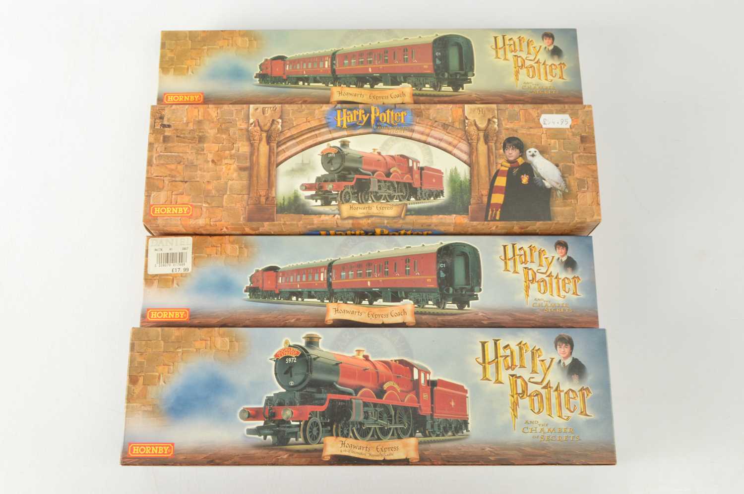 Lot 95 - Two Hornby 00 Gauge boxed Harry Potter Hogwarts's Castle Steam Locomotives and Tenders and two Coaches (4)