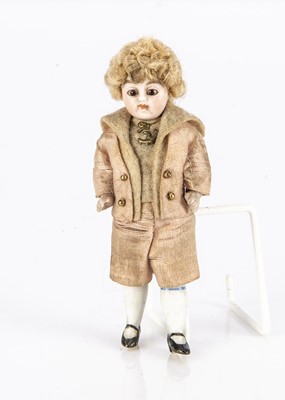 Lot 822 - An all-bisque dolls’ house boy doll