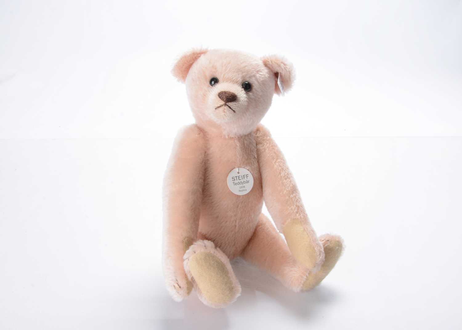 Lot 68 - A Steiff limited edition 1908 replica pink mohair teddy bear