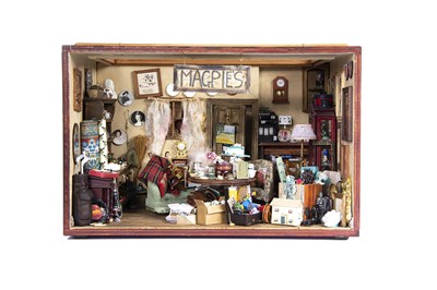 Lot 864 - A model miniaturist dolls’ house Magpies junk shop room box