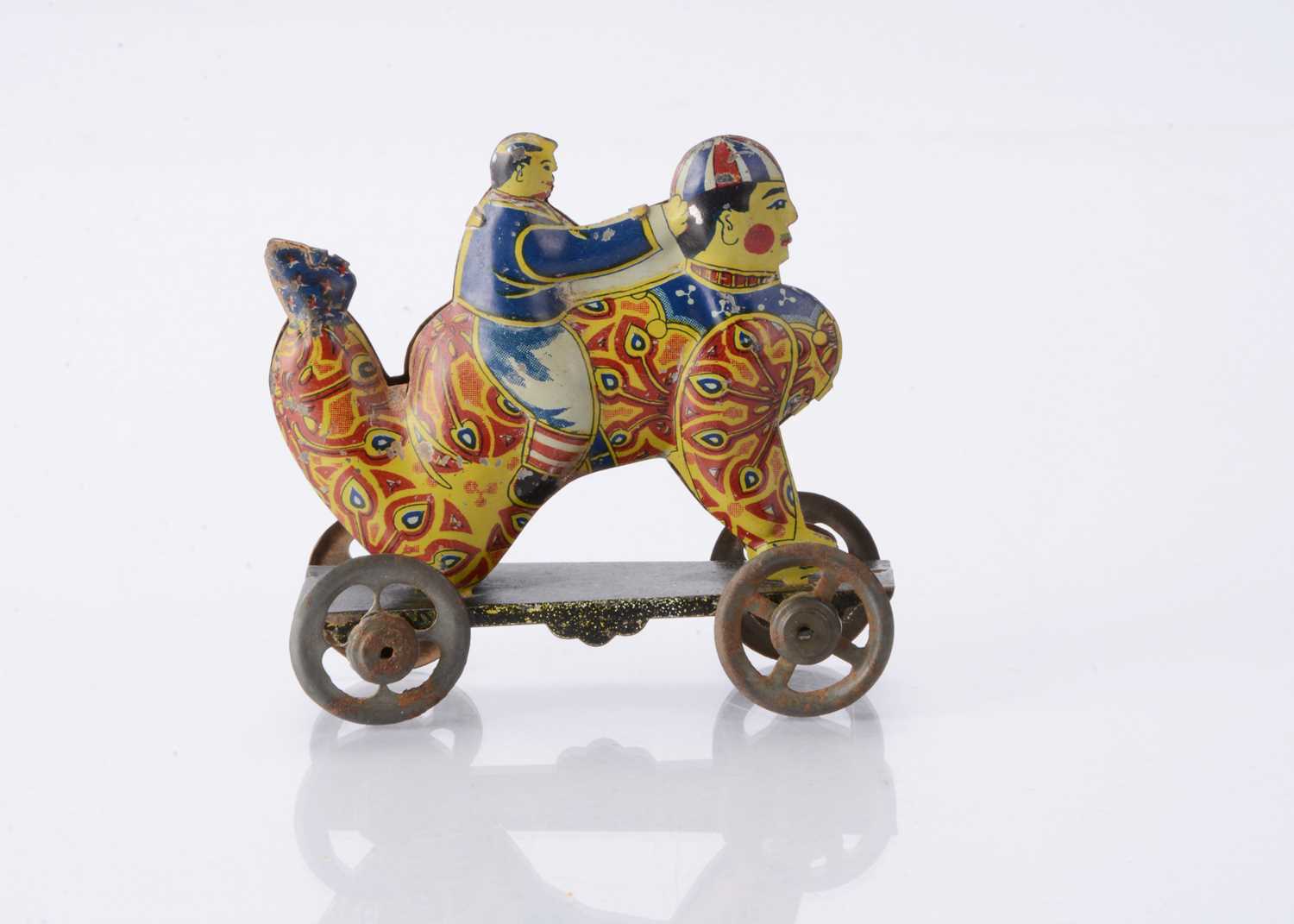 Lot 411 - A Japanese Penny Toy of a boy riding a clown
