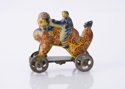 Lot 411 - A Japanese Penny Toy of a boy riding a clown