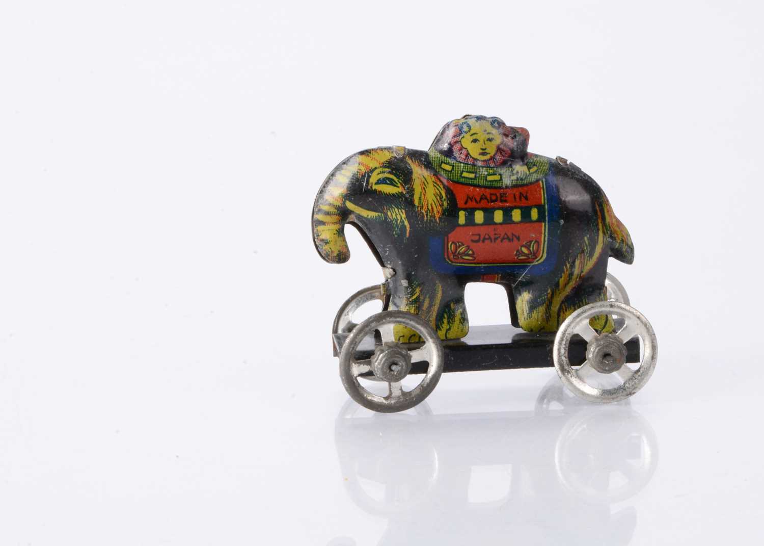 Lot 413 - A Japanese Penny Toy elephant with clown head