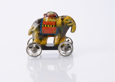 Lot 413 - A Japanese Penny Toy elephant with clown head