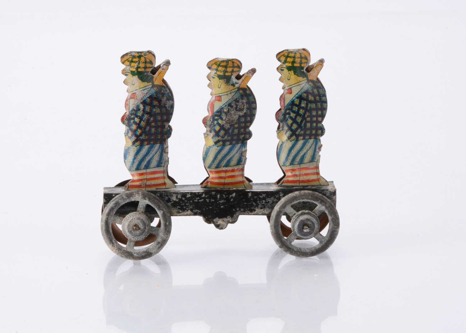 Lot 415 - A Japanese Penny Toy of three sporting hunters
