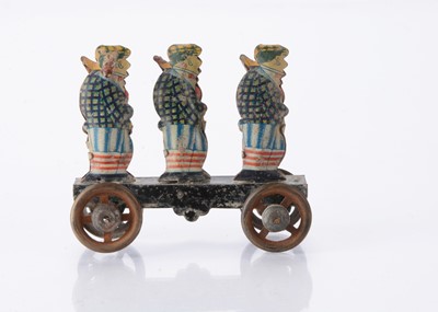 Lot 415 - A Japanese Penny Toy of three sporting hunters