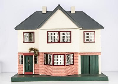 Lot 890 - A 1938 Tri-ang wooden dolls’ house No 91