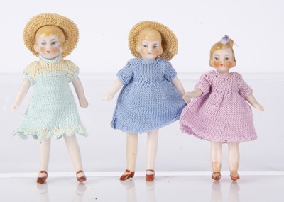 Lot 899 - Three German 1920-30s all-bisque dolls’ house girl dolls