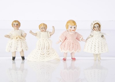 Lot 903 - Four German small all-bisque dolls’ house child dolls