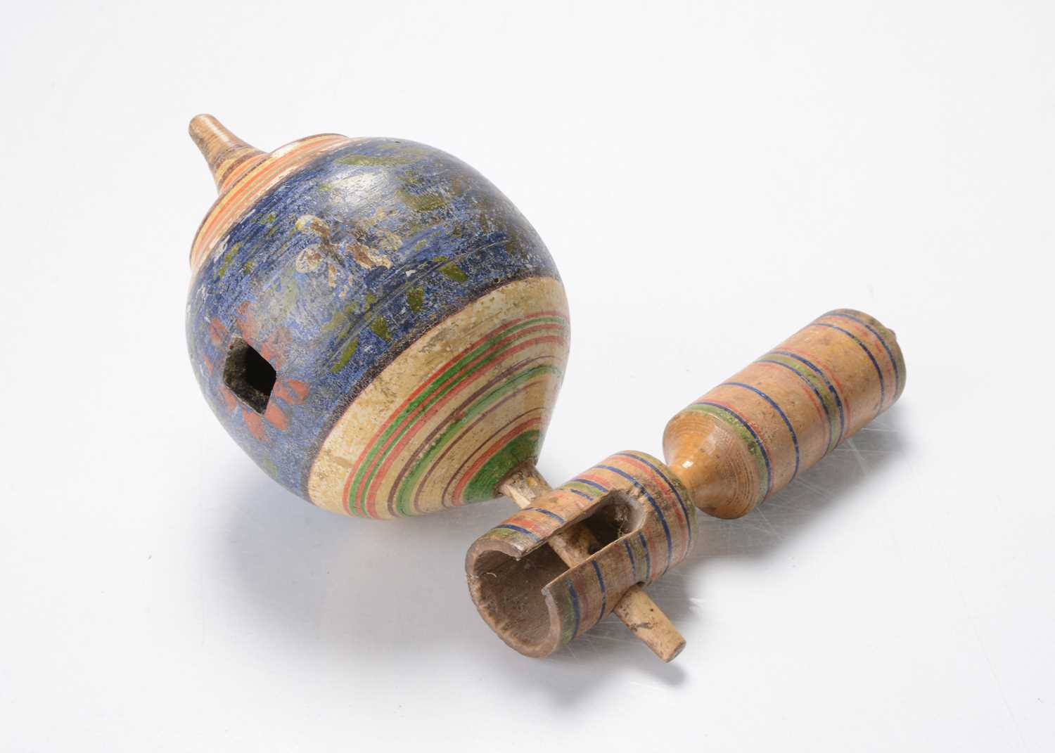 Lot 619 - An early 19th century turned wooden whistling spinning top
