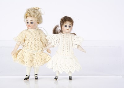 Lot 909 - Two all-bisque dolls’ house dolls