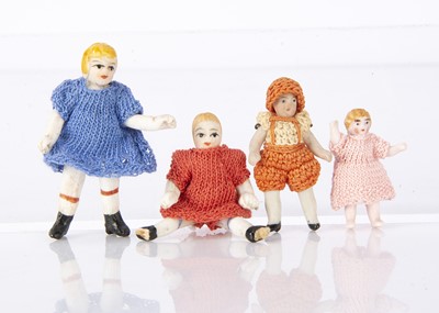 Lot 911 - Four German tiny all-bisque dolls’ house dolls