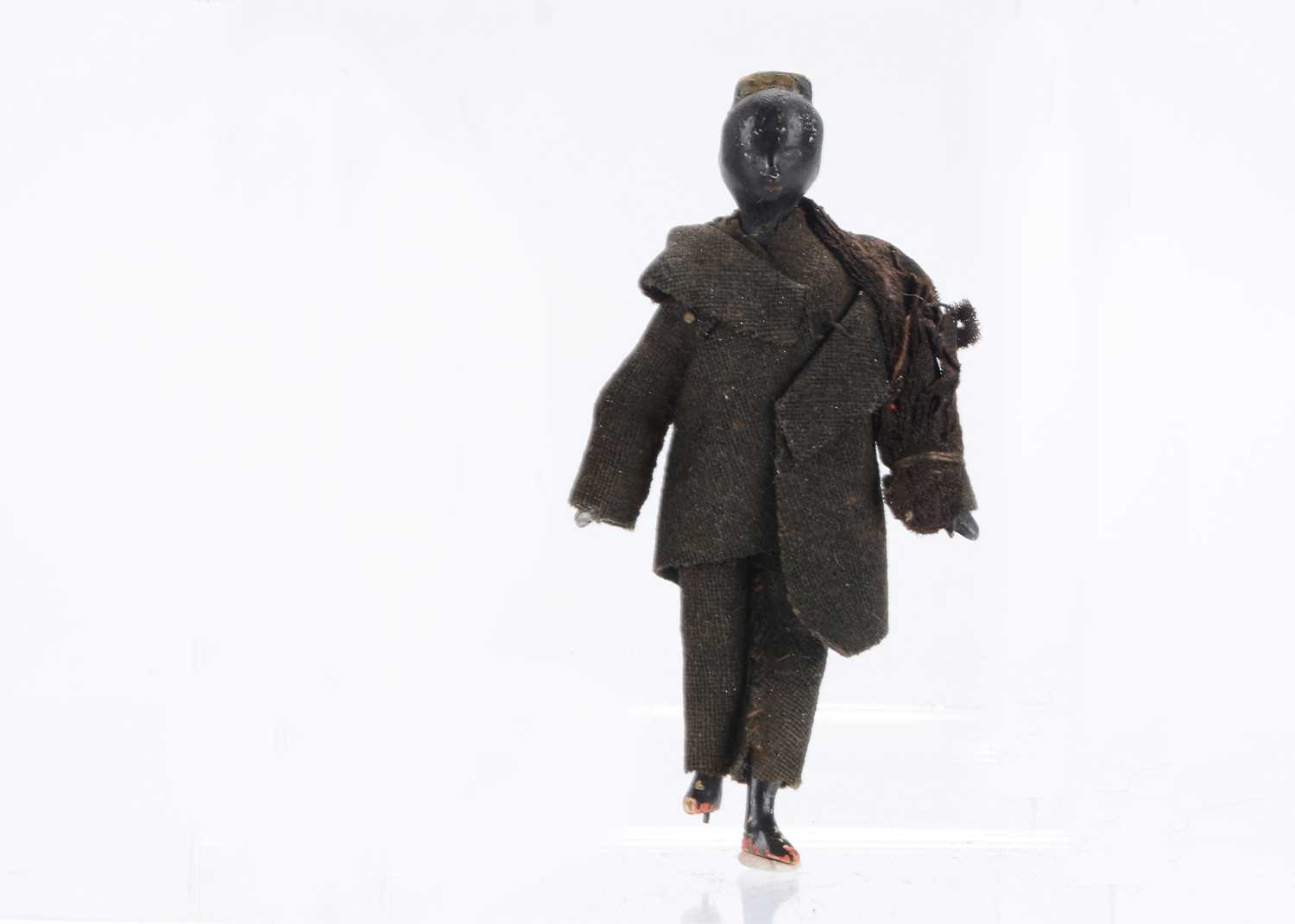 Lot 722 - An unusual mid 19th century Grodnerthal dolls’ house black doll