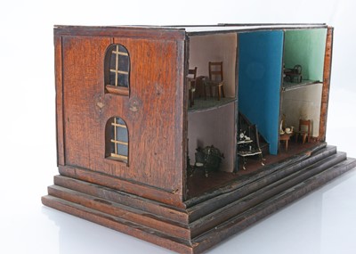 Lot 724 - An early 19th century small Palladian style stained wood dolls’ house