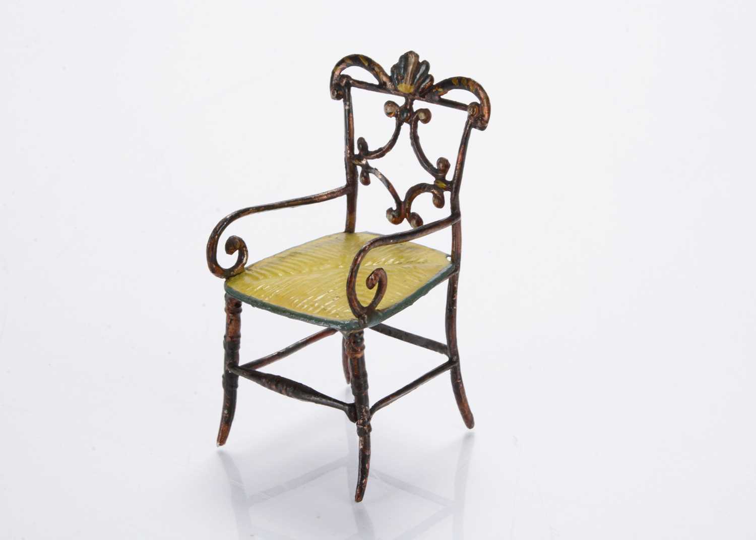 Lot 812 - A mid 19th century pewter dolls’ house ornate chair