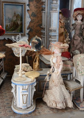 Lot 1080 - A rare late 19th century Gottschalk wooden dolls’ house room millinery shop